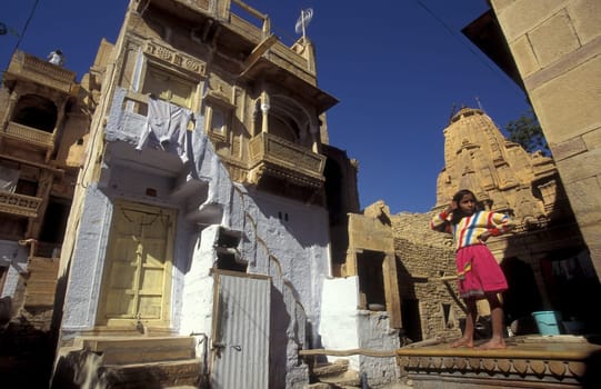 a Child is playing in the old Town in the Jaisalmer Fort with the city of Jaisalmer in the Province of Rajasthan in India.  India, Jaisalmer, January, 1998
