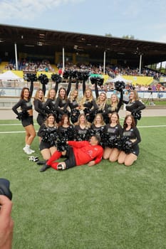 Tim Mälzer and the HSV cheerleaders,kicking the charity football match for the benefit of the UKE children's ward in the stadium of SC Victoria,Hamburg,08.09.2024