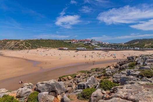Sintra, Portugal: April 13, 2024: People at the beach of Foz do Lizandro, Ericeira, Portugal