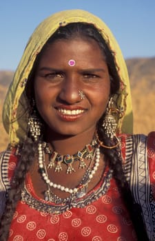 a portrait of a Rajasthani women in the Town of Jaisalmer in the Province of Rajasthan in India.  India, Jaisalmer, January, 1998