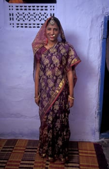 a portrait of a Rajasthani women in the Town of Jaisalmer in the Province of Rajasthan in India.  India, Jaisalmer, January, 1998