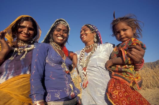 a portrait of a Rajasthani women with her Baby in the Town of Jaisalmer in the Province of Rajasthan in India.  India, Jaisalmer, January, 1998