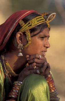 a portrait of a Rajasthani women in the Town of Jaisalmer in the Province of Rajasthan in India.  India, Jaisalmer, January, 1998