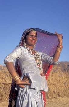 a portrait of a Rajasthani women in the Town of Jaisalmer in the Province of Rajasthan in India.  India, Jaisalmer, January, 1998