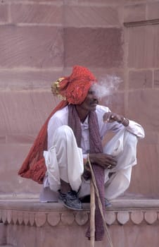 a camel herder at the Bikaner Camel Festival in the Town of Bikaner in the Province of Rajasthan in India.  India, Bikaner, January, 1998