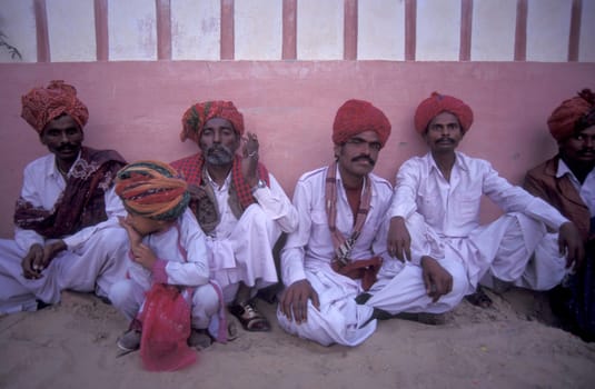 a camel herder at the Bikaner Camel Festival in the Town of Bikaner in the Province of Rajasthan in India.  India, Bikaner, January, 1998