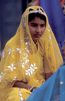Women in traditional Rajasthani dress at the Bikaner Camel Festival in the Town of Bikaner in the Province of Rajasthan in India.  India, Bikaner, January, 1998