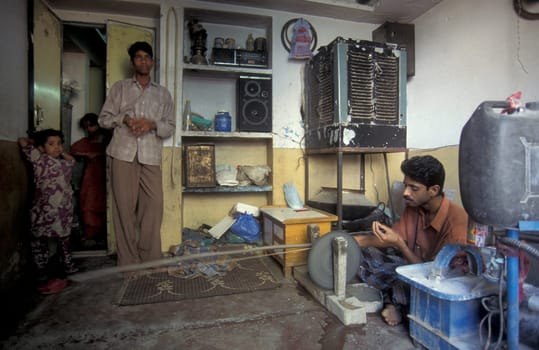 Working People in a Factory of gemstone cutting in the City of Jaipur in the Province of Rajasthan in India.  India, JAIPUR, January, 1998
