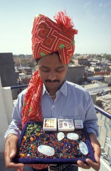 The Boss of a  Gemstone Trading company and Factory of gemstone cutting in the City of Jaipur in the Province of Rajasthan in India.  India, JAIPUR, January, 1998