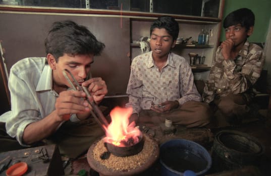 Working People in a Jewelry Factory in the City of Jaipur in the Province of Rajasthan in India.  India, Jaipur, January, 1998