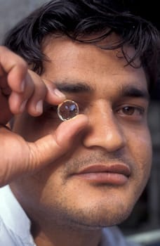 Working People in a Factory of gemstone cutting in the City of Jaipur in the Province of Rajasthan in India.  India, JAIPUR, January, 1998