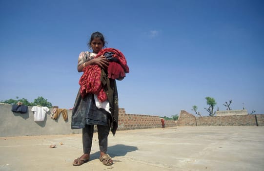 a women at her Laundry homework in the City of Jaipur in the Province of Rajasthan in India.  India, JAIPUR, January, 1998