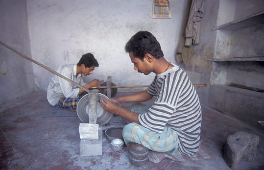 Working People in a Factory of gemstone cutting in the City of Jaipur in the Province of Rajasthan in India.  India, JAIPUR, January, 1998