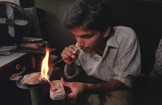 Working People in a Jewelry Factory in the City of Jaipur in the Province of Rajasthan in India.  India, Jaipur, January, 1998