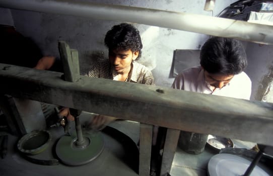 Working People in a Factory of gemstone cutting in the City of Jaipur in the Province of Rajasthan in India.  India, JAIPUR, January, 1998