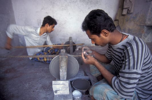 Working People in a Factory of gemstone cutting in the City of Jaipur in the Province of Rajasthan in India.  India, JAIPUR, January, 1998