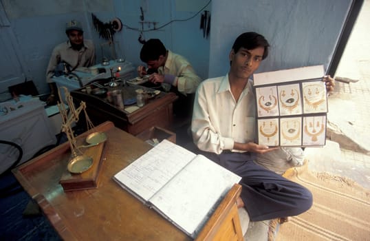 Working People in a Jewelry Factory in the City of Jaipur in the Province of Rajasthan in India.  India, Jaipur, January, 1998