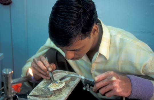 Working People in a Jewelry Factory in the City of Jaipur in the Province of Rajasthan in India.  India, Jaipur, January, 1998