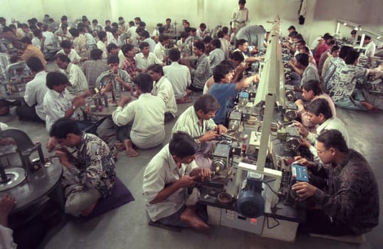 Working People in a Factory of gemstone cutting in the City of Jaipur in the Province of Rajasthan in India.  India, JAIPUR, January, 1998