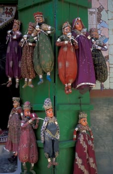a indian Kitputli Dance Puppet figures shop in the City of Jaipur in the Province of Rajasthan in India.  India, Jaipur, January, 1998
