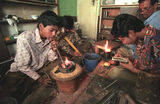 Working People in a Jewelry Factory in the City of Jaipur in the Province of Rajasthan in India.  India, Jaipur, January, 1998
