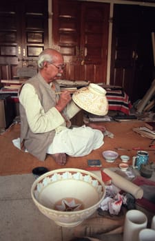 Working People in a Pottery Factory in the City of Jaipur in the Province of Rajasthan in India.  India, Jaipur, January, 1998