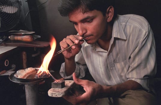 Working People in a Jewelry Factory in the City of Jaipur in the Province of Rajasthan in India.  India, Jaipur, January, 1998