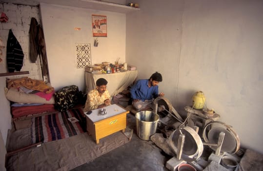 Working People in a Factory of gemstone cutting in the City of Jaipur in the Province of Rajasthan in India.  India, JAIPUR, January, 1998