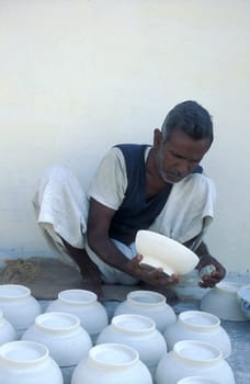Working People in a Pottery Factory in the City of Jaipur in the Province of Rajasthan in India.  India, Jaipur, January, 1998