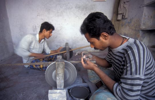 Working People in a Factory of gemstone cutting in the City of Jaipur in the Province of Rajasthan in India.  India, JAIPUR, January, 1998