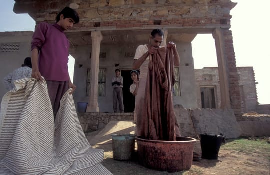 Working People in a textile coloring and dryeing Factory in the City of Jaipur in the Province of Rajasthan in India.  India, Jaipur, January, 1998