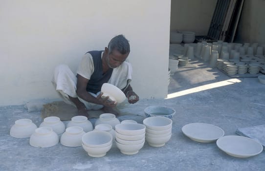 Working People in a Pottery Factory in the City of Jaipur in the Province of Rajasthan in India.  India, Jaipur, January, 1998