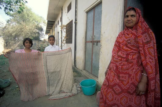 Working People in a textile coloring and dryeing Factory in the City of Jaipur in the Province of Rajasthan in India.  India, Jaipur, January, 1998