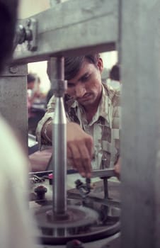 Working People in a Factory of gemstone cutting in the City of Jaipur in the Province of Rajasthan in India.  India, JAIPUR, January, 1998
