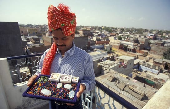 The Boss of a  Gemstone Trading company and Factory of gemstone cutting in the City of Jaipur in the Province of Rajasthan in India.  India, JAIPUR, January, 1998
