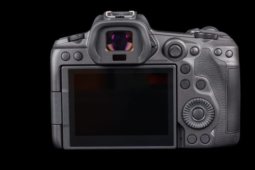 black 2020s professional 35mm full-frame mirrorless camera body with flip screen isolated on black background.