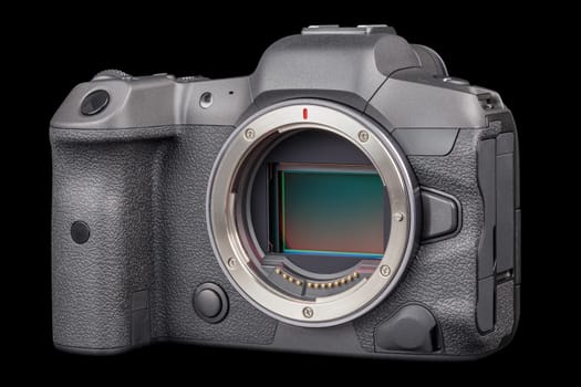 black 2020s professional 35mm full-frame mirrorless camera body with flip screen isolated on black background.