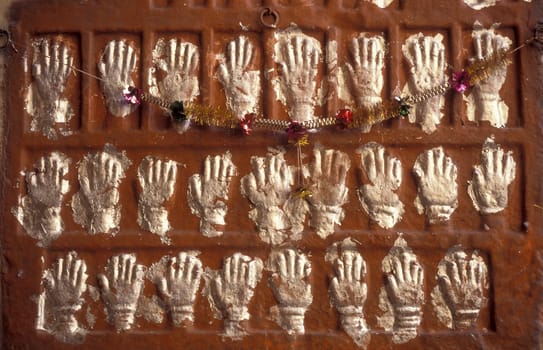 Women Queens Handprints of Sati and grid of Sculpted hands at the Meherangarh in the Town of Jodhpur in the Province of Rajasthan in India.  India, Jodhpur, January, 1998