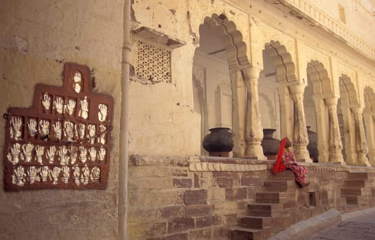 Women Queens Handprints of Sati and grid of Sculpted hands at the Meherangarh in the Town of Jodhpur in the Province of Rajasthan in India.  India, Jodhpur, January, 1998