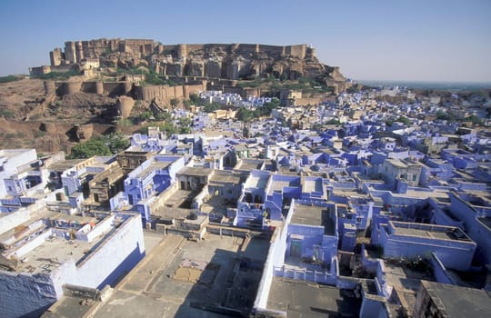 a view of the Meherangarh in the Town and Blue City of Jodhpur in the Province of Rajasthan in India.  India, Jodhpur, January, 1998