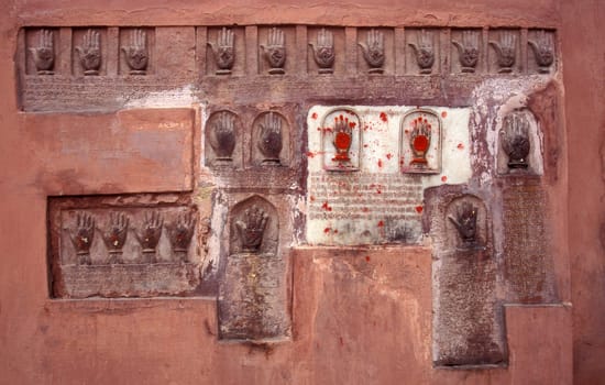 Women Queens Handprints of Sati and grid of Sculpted hands at the Meherangarh in the Town of Jodhpur in the Province of Rajasthan in India.  India, Jodhpur, January, 1998