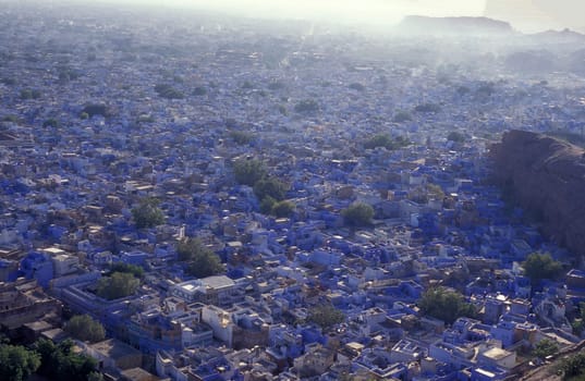 a view with living Houses in the Blue City and Town of Jodhpur in the Province of Rajasthan in India.  India, Jodhpur, January, 1998