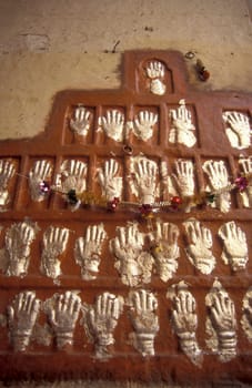 Women Queens Handprints of Sati and grid of Sculpted hands at the Meherangarh in the Town of Jodhpur in the Province of Rajasthan in India.  India, Jodhpur, January, 1998