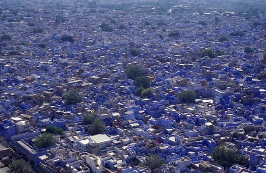 a view with living Houses in the Blue City and Town of Jodhpur in the Province of Rajasthan in India.  India, Jodhpur, January, 1998