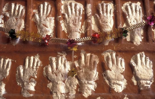 Women Queens Handprints of Sati and grid of Sculpted hands at the Meherangarh in the Town of Jodhpur in the Province of Rajasthan in India.  India, Jodhpur, January, 1998