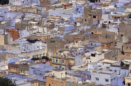 a view with living Houses in the Blue City and Town of Jodhpur in the Province of Rajasthan in India.  India, Jodhpur, January, 1998