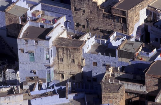 a view with living Houses in the Blue City and Town of Jodhpur in the Province of Rajasthan in India.  India, Jodhpur, January, 1998