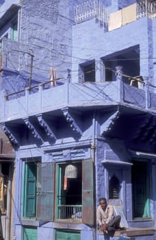 a blue painted living House in the Blue City and Town of Jodhpur in the Province of Rajasthan in India.  India, Jodhpur, January, 1998