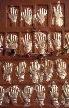 Women Queens Handprints of Sati and grid of Sculpted hands at the Meherangarh in the Town of Jodhpur in the Province of Rajasthan in India.  India, Jodhpur, January, 1998