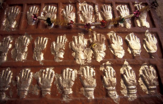 Women Queens Handprints of Sati and grid of Sculpted hands at the Meherangarh in the Town of Jodhpur in the Province of Rajasthan in India.  India, Jodhpur, January, 1998